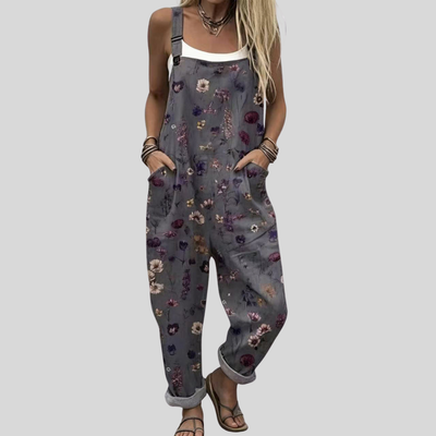Graue Latzhose mit bunten Blümchen